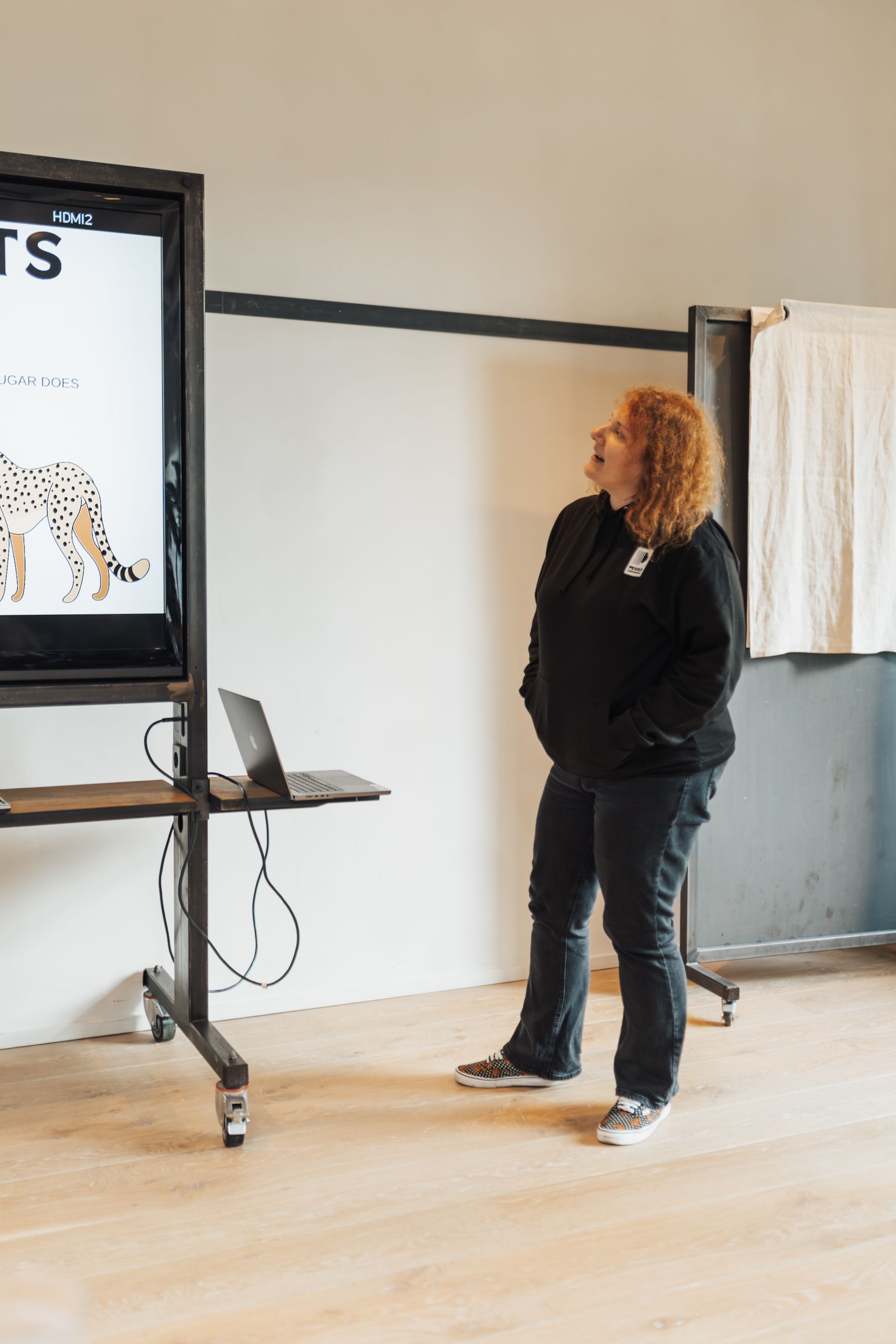 A presenter using a large digital display in a modern workplace